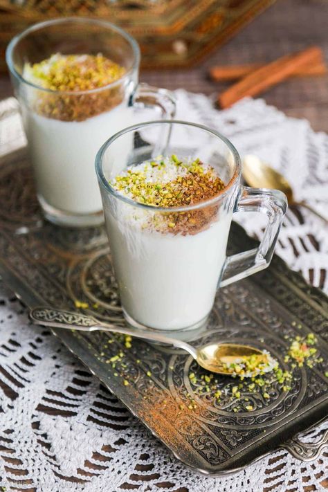 Silky smooth and comforting Middle Eastern sweet milk pudding topped with a sprinkle of ground cinnamon, crushed nuts, and desiccated coconut. #sahlab #middleeastern #milkpudding Milk Pudding Recipe, Middle Eastern Sweets, Arabic Sweets Recipes, Little Sunny Kitchen, Milk Pudding, Middle East Food, Middle East Recipes, Arabic Dessert, Sunny Kitchen