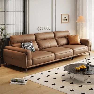 Introduce our sofa, a contemporary design that embodies minimalist elegance. The sofa features a soft and pleasing pink hue that complements its Genuine Leather upholstery. This high-quality leather offers a luxurious touch, offering unparalleled durability and a smooth, supple feel. The seat cushions are filled with a combination of high-density foam and latex, ensuring a plush seating experience. This unique filling provides exceptional comfort, with a soft yet resilient feel. The back cushion High Back Leather Sofa, Chaise Longue, Best Sofa Designs For Living Room, Italian Sofa Design Luxury, Sofa 2024, Sofa Design Living Rooms, Living Sofas, Luxury Leather Sofas, Italian Sofa Designs