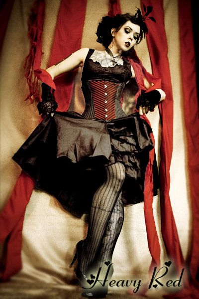 This is my next ensemble for Dorian's Parlor. It is exactly what I've been looking for -- dark, burlesque, sort of Wonderland-y in a non-obvious way. Heavy Red makes a version of this dress with a red and black underskirt. Now I just need to decide which version to get. Steampunk Circus, Burlesque Vintage, Halloween Fantasias, Gothic Type, Dark Alice In Wonderland, Pierrot Clown, Dark Circus, Black Ruffle Dress, Gothic Steampunk