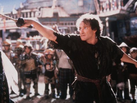 Williams plays Peter Banning in 1991's "Hook."  The Kobal Collection Hook Robin Williams, Hook Movie, Robin Williams Actor, 1990s Movies, Pro Skaters, Twilight Book, Movie Aesthetic, Kids' Movies, Robbie Williams