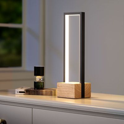 Illuminate your surroundings with style and functionality like never before. With its sleek design and wooden base, this lamp is a must-have for any contemporary home or office. Experience versatility like never before with the 3 color temperatures feature. Choose between 3000K, 4500K, and 6000K to create the perfect ambiance for any occasion. Whether you're working, reading, or simply relaxing, this lamp provides the ideal lighting to suit your needs. Not only does this lamp offer a range of co Modern Nightstand Lamps, Wood Lamp Design, Dimmable Table Lamp, Desk Lamp Office, House Interior Design Styles, Bed Lamp, Modern Desk Lamp, Fixture Table, Wood Lamp