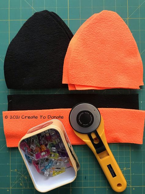 This free reversible fleece hat pattern is a quick and cost effective project for DIY gifts as well as something to make and donate to shelters. The projects is a beginner project and is a great option for anyone who is working with fleece for the first time. Fleece Cat Hat Pattern, How To Make A Fleece Hat, Mens Fleece Hat Pattern Free, Couture, How To Make Beanies Diy, Free Fleece Hat Patterns To Sew, Fleece Hat Sewing Pattern, Fleece Ear Warmer Pattern Free, Sewing Projects With Fleece