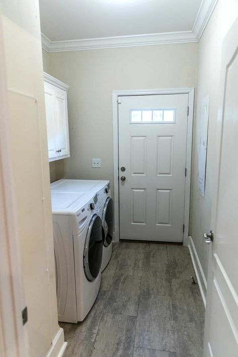 Laundry rooms are essential in any home, and the right layout can make all the difference. Here are 15 laundry room layouts, each accompanied by design ideas to help you create a space that's both functional and chic. Laundry Room Location Ideas, Laundry Galley Style, Walkthrough Laundry Mudroom, Long And Narrow Laundry Room Ideas, Laundry Room Mud Room Combo Small Layout, Walk Thru Laundry Room From Garage, Open Laundry Room Ideas Hallways, Walkthrough Laundry Room, Front Load Laundry Room Ideas