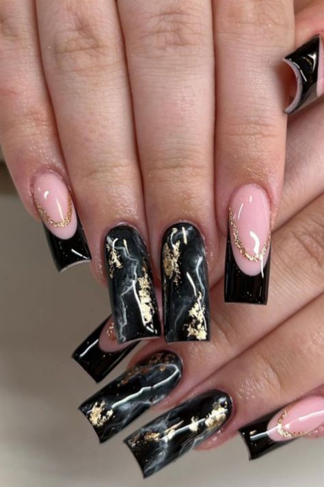 Extravagant and dramatic with specs of gold foil, this black marble nail art design on square tips will make a bold style statement. Extravagant Black Nails, Black Nail Designs Marble, Black And Gold Square Nails, Black Marble Acrylic Nails, Black And Gold Marble Nails, Black Marble Nail Art, Black Foil Nails, Extravagant Nails Designs, Nail Ideas Silver