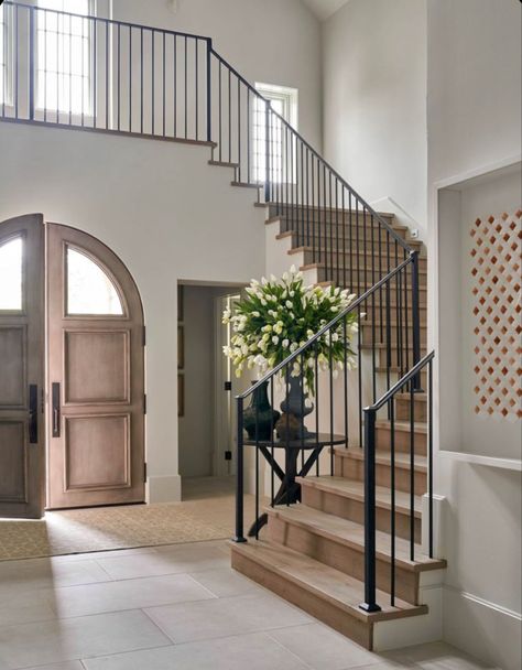 // s t a i r s Stairs Connecting Two Floors, Medaterain House Interior, Tudor House Modern Interior Design, Double Foyer Entryway, Arch Top Front Door, Wrap Around Staircase, Cool Barndominium Ideas, Opening Staircase Wall Before And After, Modern Organic Staircase