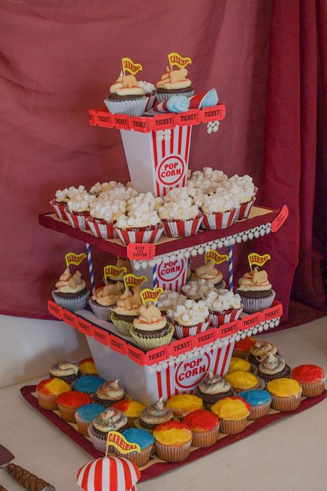 Handmade Cupcake stand to hold our cupcakes we decorated ourselves for the big day! Circus Cupcakes Carnival, Popcorn Theme Birthday Party, Carnival Theme Dessert Table, Circus Birthday Cupcakes, Carnival Cupcakes Birthday, Amusement Park Party Theme, Carnival Sheet Cake, Circus Theme Kids Party, Carnival Birthday Cupcakes