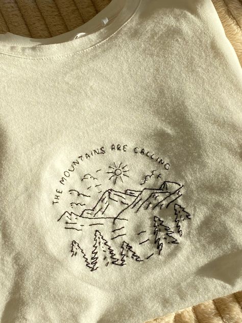 How To Embroider On A Tshirt, Embroidered Mountains Simple, Tshirt With Embroidery, Embroidery Outdoorsy, Mountain Embroidery Simple, Mom Embroidery Ideas, Broderie Sur Tee Shirt, August Embroidery, Embroidery Hoodie Diy