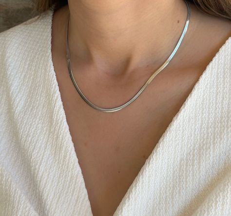 Elevate your style with our Thick Silver Snake Stainless Steel Herringbone Chain Necklace for Women. This exquisite piece combines bold design with a touch of sophistication, making it a perfect accessory for any occasion. The thick snake chain adds a modern twist to the classic herringbone pattern, creating a unique and eye-catching look. Thick Silver Necklace, Silver Snake Necklace, Jewellery Wishlist, Snake Necklace Silver, Herringbone Chain Necklace, Fancy Jewellery Designs, Stainless Steel Chain Necklace, Herringbone Chain, Snake Necklace