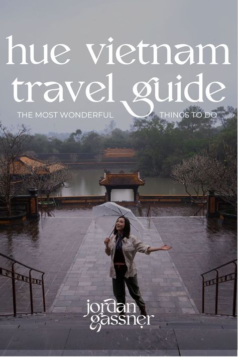 The text "Hue Vietnam Travel Guide: The Most Wonderful Things To Do" overlaying a photo of Travel Blogger Jordan Gassner climbing a staircase outside of the Tomb of Tu Duc, holding out her hand from under an umbrella to catch raindrops in Hue, Vietnam Vietnam Destinations, Bach Ma National Park, Vietnam Guide, Imperial City, Hue Vietnam, Vietnam Itinerary, Travel Vietnam, Vietnam Travel Guide, Planning A Trip