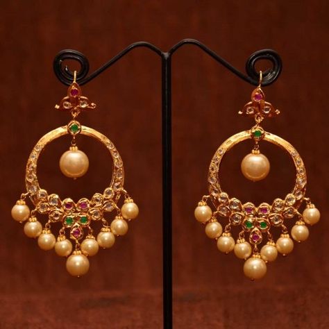 Anvi's chand bali studded with uncut stones, rubies, emeralds with pearl hangings Chand Bali, Gold Jhumka Earrings, Perhiasan India, Bali Earrings, Gold Jewelry Simple Necklace, Gold Jewelery, Chandbali Earrings, Wedding Jewellery Collection, Black Beaded Jewelry