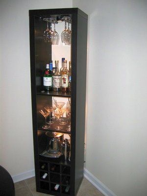 "I needed a bar unit to hold some stemware, liquor, and wine. While my new place has tons of vertical space (3 meter high ceilings), I didn't have a lot of floor space in my dining nook. Therefore, I decided a tall, vertical rack would be best. When I was unable to find one that suited me, I decided to make one out of a few parts from Ikea. Corner Bar Cabinet, Coin Bar, Corner Bar, Bar Unit, Ikea Hackers, Bar Room, Diy Bar, Bookshelves Diy, Dining Nook