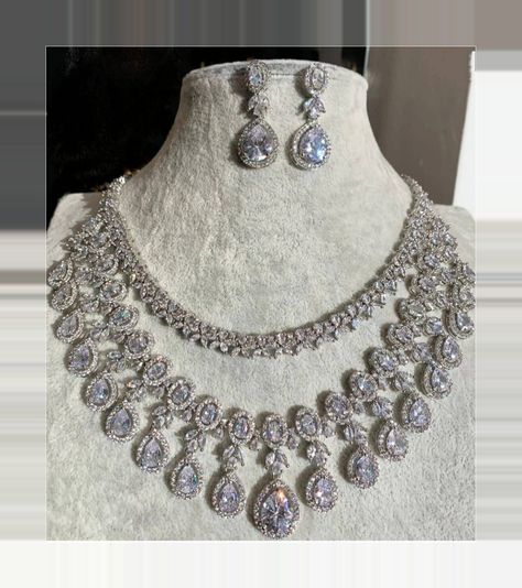 [SponsoredPost] Very Pretty And Gorgeous Cz Necklace With Matching Earrings And 51 K White Gold Plating. Aaa Korean Cz Stones Used Delicate And Elegant Necklace Length- 51 Inches Earrings Length- 1.5 Inches Earrings Weight- 8 Grams Per Earring. These Are Lightweight Necklace Has Adjustable Chain. Earrings Have Pushbacks Highest Quality And Craftsmanship Customized Orders Takes 8 To 8 Weeks, Depending On Piece Requirements. The Ombre Designs Jewelry Pieces Can #bridalstatementnecklace White Stone Jewelry, Diamond Necklace Wedding, Bridal Statement Necklace, Bridal Diamond Necklace, Indian Wedding Jewelry Sets, Statement Jewelry Sets, Fancy Jewelry Necklace, Diamond Jewelry Set, Pretty Jewelry Necklaces