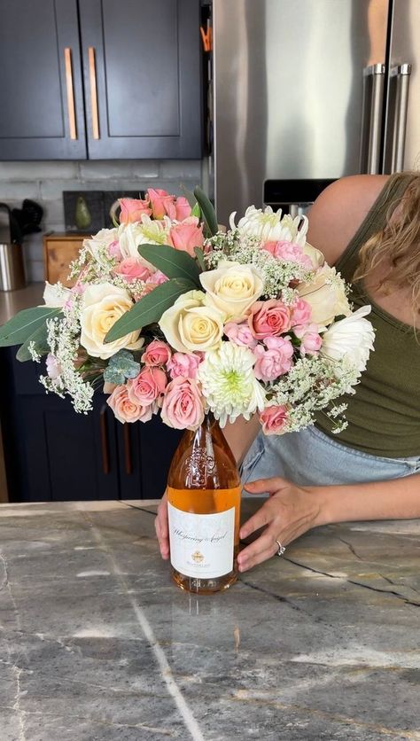 Easy gift idea💜 | Rick Lax, gift, wine bottle, video recording | Easy gift idea💜 Justine makes a beautiful floral arrangement using a wine bottle as the base. This original video was produced by Network Media, Rick... | By Allie and Friends Justine Kameron, Wine Bottle Flowers, Wine Gifts Diy, Easy Gift Idea, Flowers Wine, Flower Bottle, Diy Arrangements, Wine Mom, Wine Bottle Gift