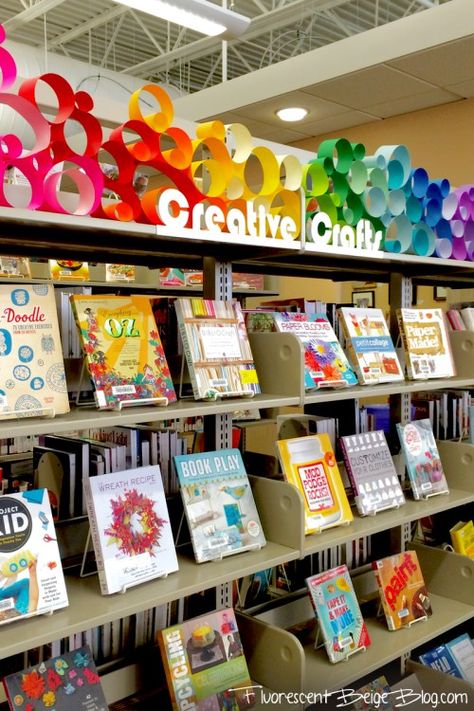 Mich - paper circles on window ledge to block first foot of window - - And a whole book about mod podge!?! , Library Display Cabinet, Display Board Borders Ideas, Rainbow Book Display, Mlk Library Displays, Dynamic Shelving School Library, Public Library Displays, Creative Book Display, Books Display Ideas, School Library Decor