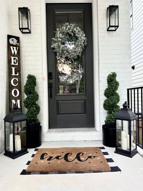 Modern Farmhouse, black and white design, minimalist, minimalism, boxwood trees, buffalo plaid, lanterns Small Front Porch Decorating, Veranda Design, Small Porch Decorating, Doorway Decor, House Front Porch, Outdoor Entryway, Black Front Doors, Front Porch Design, Small Front Porches