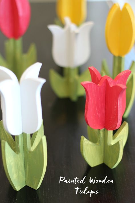 DIY painted wooden tulips. Super cute springtime decor! Wooden Spring Decor, Tulip Decorations, Diy Wooden Crafts, Wooden Tulips, Springtime Decor, Wooden Crafts Diy, Tulip Decor, Wood Yard Art, Easter Wood Crafts