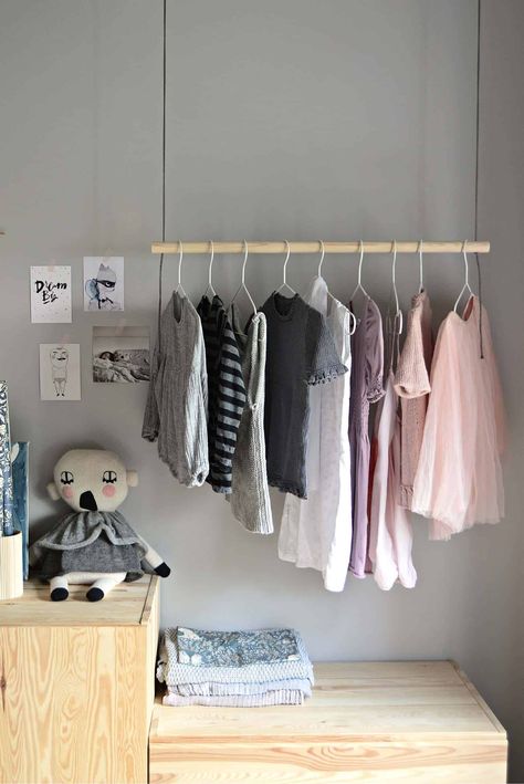 A simple pipe clothing rack can cost more than $100 from a trendy retailer, or it can cost a fraction of that if you do it yourself at home.... | 21-Hanging-Clothes-Rack-684x1024 #DIYclothesrack #clothesrack #rack #diyrack #closet #organizecloset #diy #desertdomicile Diy Hanging Clothes Rack, Diy Clothes Hanging, Diy Hanging Clothes, Diy Clothes Hanger, Clothes Rack Diy, Diy Clothes Hanger Rack, Clothes Storage Solutions, Wood Clothing Rack, Hanging Clothes Rack