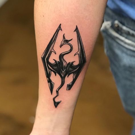 #Tattoos,skyrim tattoo Skyrim Tattoo Design, Skyrim Symbol Tattoo, Skyrim Logo Tattoo, Skyrim Tattoo Sleeve, Video Game Tattoo Ideas For Men, Skyrim Tattoo Symbols, Alduin Skyrim Tattoo, Skyrim Dragon Tattoo, Gamer Tattoo Ideas