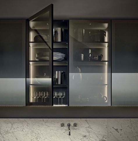 a kitchen cabinet with smoke glass doors shows off the glasses and dishes but gently Kitchen Minimal, Glass Kitchen Cabinets, Minimal Kitchen, Casa Country, Kitchen Glass, Interior Minimalista, Kitchen Dinning, Glass Cabinet, Glass Kitchen