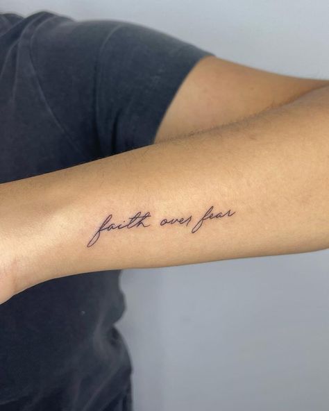 Faith Tiny Tattoos, Strength From Love Tattoo, Universal Tattoo Ideas, Inspiring Quotes For Tattoos, Fear Over Faith, Small Cute Tattoos With Meaning, Faith Over Fear Wrist Tattoo, God Fine Line Tattoo, Cute Subtle Tattoos