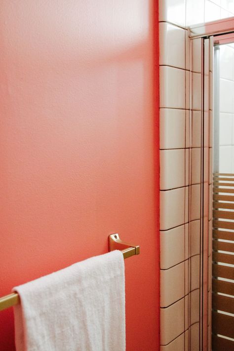 Retro details in a tiny pink and gold bathroom (paint color: @dutchboypaint Coral Clay) Coral Color Bathroom Ideas, Coral Bathroom Walls, Orange And Pink Bathroom, Coral Bathroom Ideas, Pink And Orange Bathroom, Bathroom Gold Accents, Coral Pink Bathroom, Bathroom With Gold Accents, Orange Bathroom Ideas