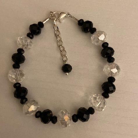 Handmade black and clear glass beaded bracelet. Black Bracelets Aesthetic, Clear Bracelet Ideas, Clear Bead Bracelet, Simple Bead Bracelet Patterns, Black And White Bracelets Beads, Goth Beaded Bracelet, Simple Beaded Bracelets Ideas, Glass Bead Bracelet Ideas Aesthetic, Black Bracelet Ideas