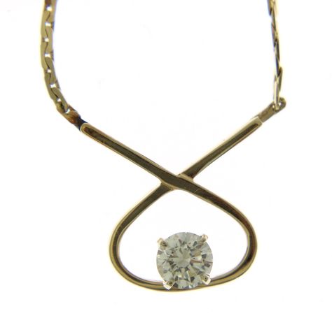 Gorgeous Vintage 14K Diamond 'Figure 8' Necklace.  Crafted in the '90's , from an old estate.  Serpentine Chain Necklace is 16" in length, and has an overall weight of 4.8g. Piece feels great on the neck, not too light or heavy. Round Brilliant Diamond measures 5.4mm, and weighs .65ct. Diamond is graded as 'J' in Color, and 'VS1' in Clarity.  Any questions feel free to reach out, I am a GIA trained Diamond grader, and can answer more specific questions about the Diamond should you have them. Old Estate, Figure 8, Brilliant Diamond, Feeling Great, Round Brilliant, Labour Day, Jewelry Necklace Pendant, Chain Necklace, Accessory Gift