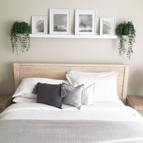 Image from Kmart Hack Queen 👸🏼 on Instagram - I love the picture rail idea above the bed 🥰 Over Bed Picture Ledge, Bedroom Decor Above Bed Ideas, Frame Above Bed Ideas, Shelf With Picture Frames Above Bed, Wall Above The Bed, Pictures Over The Bed Ideas, Shelf Above King Bed, Above Bed Picture Frames, Simple Above Bed Wall Decor