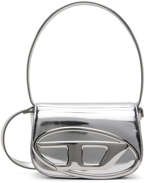 Find Diesel Silver 1dr Bag on Editorialist. Polished leather shoulder bag in metallic silver tone. · Fixed shoulder strap · Adjustable and detachable crossbody strap · Logo hardware at face · Magnetic press-stud flap · Patch pocket at two-compartment interior · Twill lining · H5.5 x W8 x D2.25 Supplier color: Silver 1dr Bag, Highlights Silver, Diesel Bag, Tone Calves, Diesel Clothing, Face Patches, Press Studs, Leather Top, Luxury Streetwear