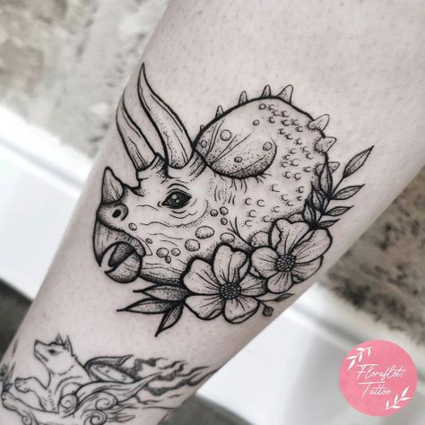 Skull Collar Bone Tattoo, Girly Dinosaur Tattoo, Traditional Tattoo Dinosaur, American Traditional Dinosaur Tattoo, Dinosaur Floral Tattoo, Dinosaur With Flowers Tattoo, Dinosaur And Flower Tattoo, Dinosaur Tattoo Realistic, Feminine Dinosaur Tattoo