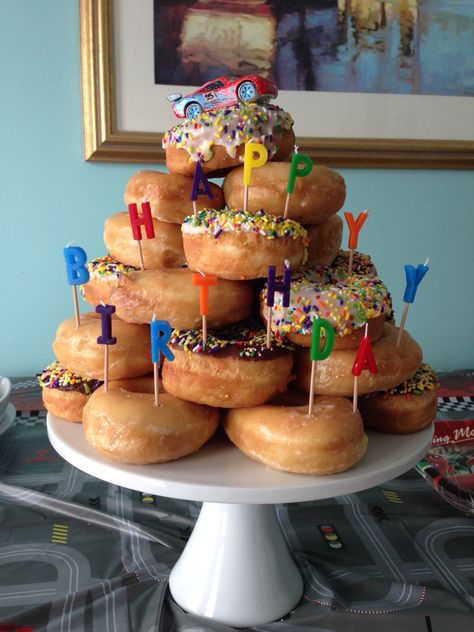 Dounat Birthday Cake, Krispy Kreme Donut Cake Birthdays, Birthday Donut Display, Birthday Dessert Display Ideas, Diy Donut Cake Tower, Donut Birthday Breakfast, Donuts Instead Of Cake Birthday Parties, Bday Cake Alternatives, Cake Made Of Donuts Birthday