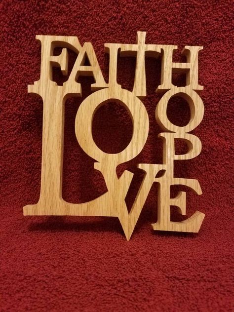 "Faith,hope, love sign cut from 1/2\" oak with a scroll saw.  Finished with gloss lacquer.   Measures 6 1/2 inches wide and 8 inches tall. This is a stock photo so wood grain may vary." Scroll Saw Signs, Scroll Saw Ideas, Woodwork Crafts, Scroll Saw Projects, Wooden Cross Crafts, Best Scroll Saw, Scrollsaw Patterns, Anna Craft, Cream Fudge