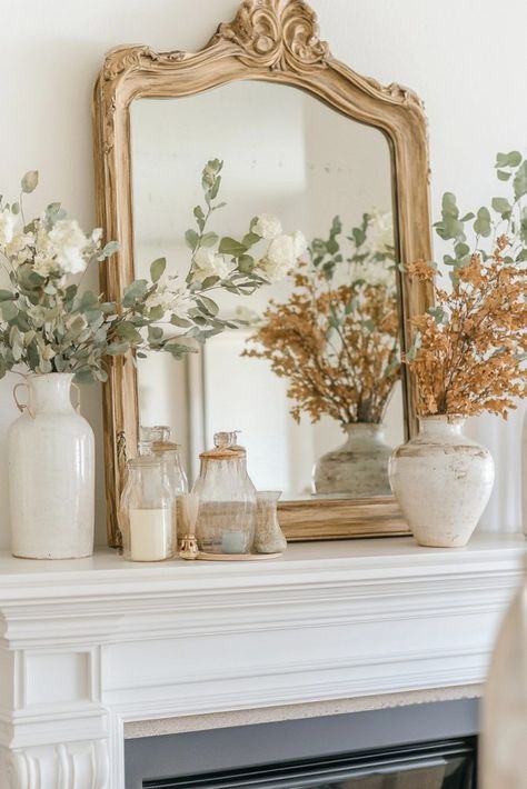 27 Beautiful Fall Mantle Ideas (That Aren't Cheesy) Shallow Mantle Decor, Mantle Piece Decor, Fire Mantel Decor Ideas, Fireplace Mantle Decor With Mirror, French Country Mantle Decor, Mirror On Mantle, Boho Mantle Decor, Fall Mantle Ideas, Boho Mantle