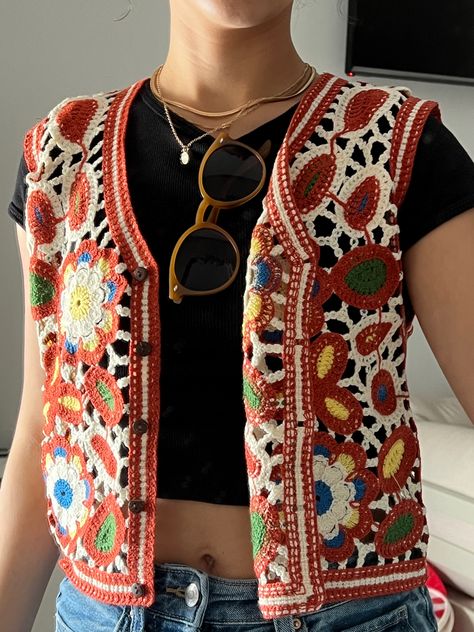 colorful crochet vest, gold accessories, sunglasses Yellow Crochet Vest, Woven Vest Outfit, Vest Crochet Outfit, Black Crochet Vest Outfit, Crochet Vest Button Up, Crochet Vest Outfit Fall, Sweater Vest In Summer, Colourful Vest Outfit, White Crochet Vest Outfit