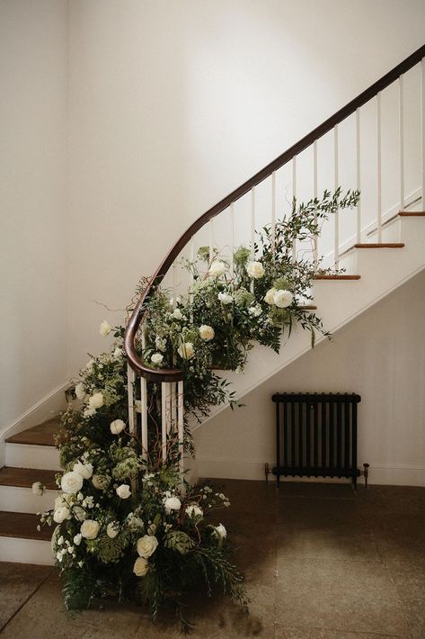 Stairs decorated with green and white wedding flowers. Aswarby Rectory wedding venue, Lincoln. Photography by Lincoln Pictures. Wedding Stairs Flowers, White Flower Staircase Wedding, White Flowers On Stairs Wedding, Staircase Garland Wedding, Wedding Flowers On Stairs, Wedding Flowers Stairs, Stairs Decor Wedding, Wedding Flowers Classic, Aswarby Rectory Wedding