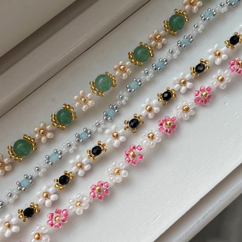 These handmade beaded bracelets feature different colored flowers and accents. Some of these bracelets have gold clasps/ chains, and others have silver. The ends of the bracelet will match what color bead is used as the center of the flowers in each bracelet! Sizing: Different sizes are available. Size small fits wrists 6.5-8.5 inches, and size medium fits wrists 7.5-9.5 inches, add .5 of an inch if you prefer a looser fit. If you need a different size feel free to message me, I can make any siz Pretty Bead Bracelets, Flower Bead Bracelet Pattern, Bracelet From Beads, Beaded Flower Jewelry, Seed Bead Inspiration, Seed Bead Bracelets Tutorials Videos, Flower Beading Patterns, Flower Seed Bead Bracelets, Flower Seed Bead Tutorial