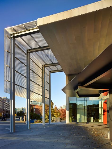 The signature feature of the new addition is an entry canopy that soars 34 feet above the pavement, joining the new addition to the existing building, designed by Antoine Predock. The canopy, which creates an outdoor gathering spot, was made with aluminum grating and stainless-steel panels fashioned from portions of the existing building that were demolished to make way for the new gallery space. Photo 2 of 8 in New Olson Kundig-Designed Wing Opens at Tacoma Art Museum Factory Architecture, Commercial Awning, Olson Kundig, Canopy Architecture, Outdoor Gathering, Warehouse Design, Backyard Canopy, Porte Cochere, Garden Canopy