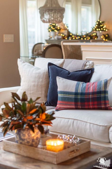 Plaid Christmas Living Room Decor with plaid throw pillow, blue velvet throw pillow, and neutral throw pillow with twinkly lights and garland. #garland #throwpillows #christmasdecor Blue Plaid Chairs Living Room, Christmas Pillows Living Room, Pool House Christmas Decorations, Blue Dining Room Christmas Decor, Fair Isle Christmas Decor, Winter Throw Pillows Couch, Plaid Pillows Living Room, Lakehouse Christmas Decor, Modern Coastal Christmas Decor