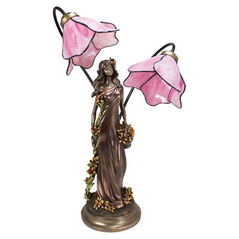 Free Shipping!30-Day Money-Back Guarantee!This beautiful table lamp harkens back to the end of the 19th Century, with its antique bronze finished base, featuring a woman in a flowing dress, bedecked with flowers, under a pair of pink petaled flower stained glass lampshades. The lamp is UL Approved and measures 25 inches tall, 10 inches long and 9 inches wide. It takes one Type B bulb up to 25 Watts (not included) and has a 5 1/2 foot long power cord. It's an elegant addition to any room.Made of Tiffany Lamps Bedroom, Cool Trinkets, Room Trinkets, Floral Lamps, Flower Lamps, Lady Lamp, Flower Stained Glass, Florida Mansion, Traditional Table Lamps