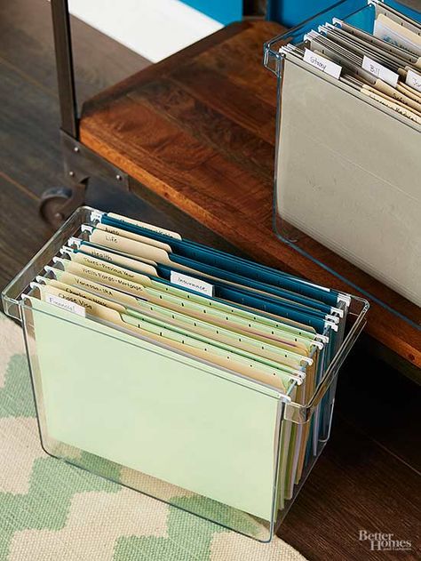 Do set up file boxes to organize papers you use monthly. Store the file boxes on a shallow table or bookcase to keep your desktop clutter free. Use four different colors of hanging file folders to help you easily distinguish between financial, insurance, personal, and household documents. Workstation Ideas, Hanging File Organizer, Craft Paper Storage, File Folder Organization, Office Organisation, File Boxes, Office Organization At Work, Folder Organization, Hanging File Folders