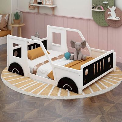 This wood full bed features a classic car shape design, cool car bed frame will make any child's transition into sleeping in their own bed easy and exciting. Perfect for hours of entertainment and relaxation, the playhouse design in bright colors, makes this wood platform beds the perfect centerpiece for any child’s bedroom. Color: Black/White | Zoomie Kids Estepp Full Size Classic Car-Shaped Platform Bed Wood in White / Black | 32 H x 57.2 W x 77.4 D in | Wayfair Wood Full Bed, Car Bed Frame, Playhouse Design, Kids Car Bed, Toddler Bed Boy, Toddler Bed Frame, House Beds For Kids, Platform Bed Wood, Kids Shared Bedroom