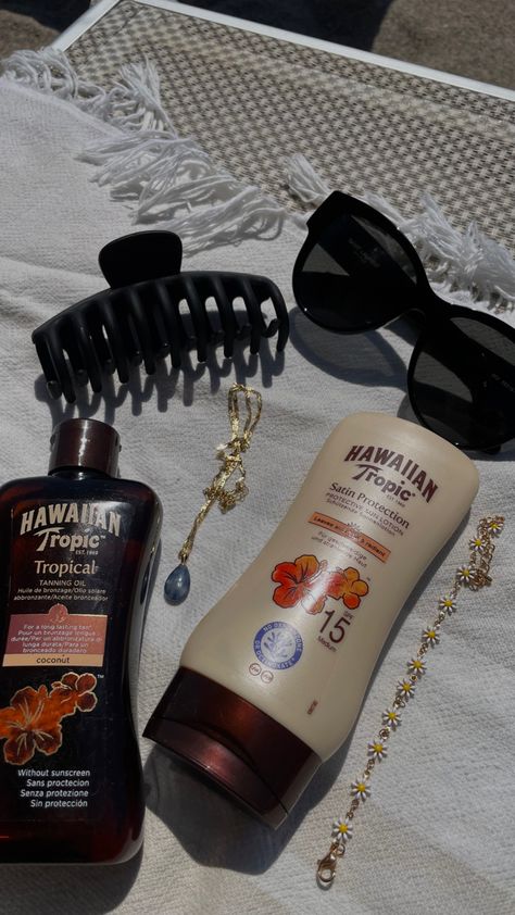 hawaiian tanning oil | sun protection | sun lotion | beach | beach towel | beach day| sunny | italy | hawaii | black yves saint lauren sunglasses | gold | cute bracelet | coconut | sunscreen | black hair clip | summer | vacation | aesthetic | hawaiian tropic | necklace | beach essentials Tan Self Care Aesthetic, Hawaii Tropic Sunscreen, Vacation Essentials Aesthetic, Beach Aesthetic Tanning, Tanning Outside Aesthetic, Tanning Lotion Aesthetic, Tanning Beach Aesthetic, Hawaiian Tropic Sunscreen Aesthetic, Best Sunscreen For Body Summer