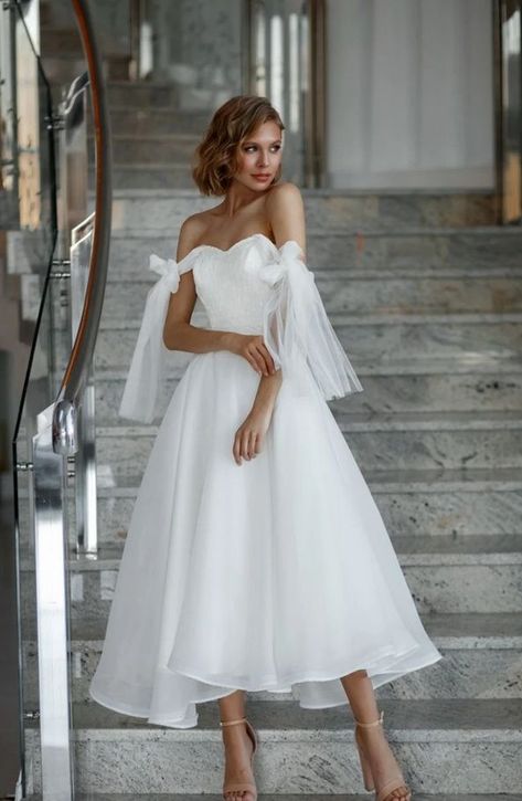 Midi wedding dress| tea length wedding dress | minimalist bridal gown | boho bridal dress | romantic wedding dress| simple wedding dress Modest and simple short wedding dress yet full of flirt and elegance. This midi wedding dress has a corset-like bodice with built-in cups with the lacing up at the back and it fits perfectly to your beautiful figure. If you are old-school, you will love this 60s style bridal gown with fluttering organza skirt with a few layers of tulle for an extra volume. Midi Wedding Dress Lace, Midi Wedding Dress Tea Length, Minimalist Bridal Gown, Midi Bridal Dress, Wedding Dress Tea Length, Wedding Dress Minimalist, Simple Wedding Dress Short, Dress Tea Length, Boho Bridal Dress