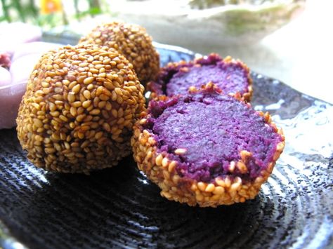 beni imo dango. =purple potato, mashed and deep-fried and rolled in sesame. pretty much worth the price of a ticket to okinawa. Beni Imo, Ube Dessert Recipe, Potato Ball, Okinawan Food, Yam Recipes, Autumn Dishes, Okinawan Sweet Potato, Ube Recipes, Yam Or Sweet Potato