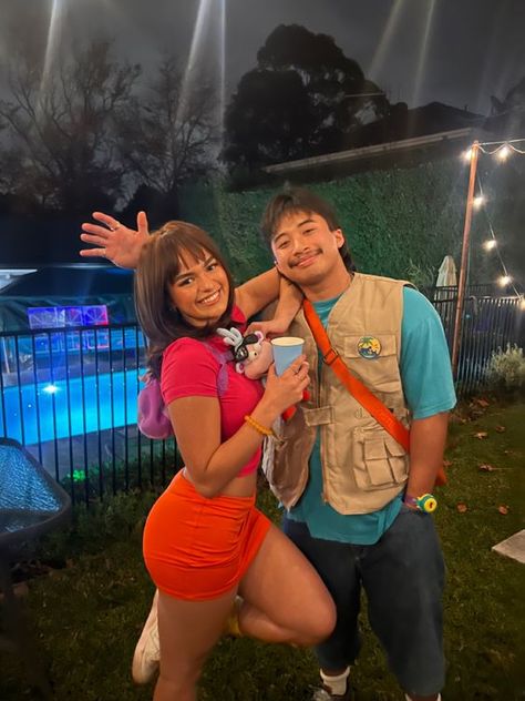 100+ Popular #HalloweenCostumes that are setting trends this year - Hike n Dip Dora And Boots Costume Women, Halloween Dora The Explorer, Dora And Diego Couple Costume, Dora Diego Costume, Dora The Explorer Halloween Costume, Dora The Explorer Cosplay, Dora Couple Costume, Dora The Explorer Costume Women, Dora Costume College