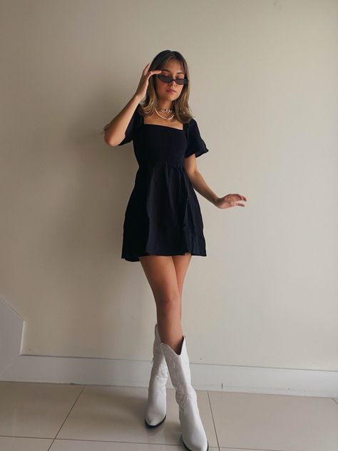 Cowboy boots 90s little black dress inpo Dress And Boots Outfit Birthday, White Cowgirl Boots Black Dress, Black Dresses Western, Outfit Ideas Cowgirl Boots, Black Dress And White Boots, Cowboy Boots And Tights Outfits, Outfits White Cowboy Boots, White Boots With Black Dress, Fancy Cowboy Boots Outfit