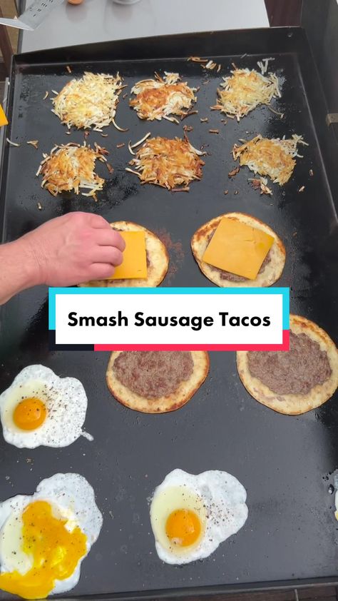 #baconuppartner Smashed Sausage Tacos! A breakfast spin on the viral s... | Breakfast Recipe | TikTok Eggs On Griddle, Black Stone Breakfast Tacos, Blackstone Sausage Recipes, Smash Breakfast Taco, Breakfast Smash Tacos, Breakfast Tacos On Blackstone, Black Stone Griddle Breakfast Recipes, Flat Top Breakfast Ideas, Breakfast On The Blackstone