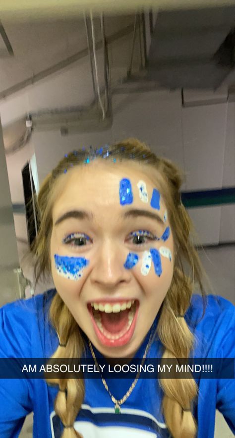 Class Colors Spirit Week Blue, Blue Out School Spirit, Blue School Spirit Outfits, Blue Spirit Day Makeup, Game Day Glitter Face, Homecoming Game Face Paint, Blue Out Game Outfit, Hoco Football Game Face Paint, Glitter Face Paint Football Game