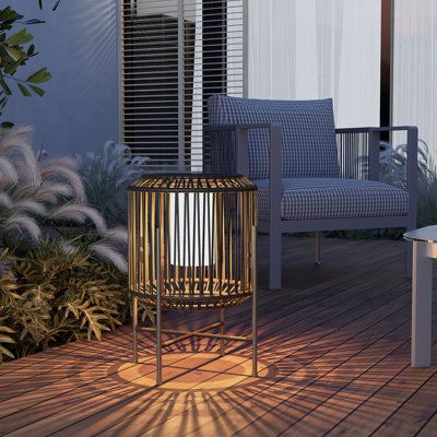 All-weather Design: Featuring an IP44 waterproof rating and a weighted base, this solar lamp is resistant to rain, snow, and other harsh weather conditions, making it a reliable option for your outdoor lighting needs. | Grand Patio 22" Solar Powered Integrated LED Outdoor Floor Lamp in Brown / Gray | 22 H x 16 W x 16 D in | Wayfair Wicker Floor Lamp, Floor Lanterns, Patio Lamp, Floor Lantern, Outdoor Solar Lanterns, Outdoor Floor Lamp, Outdoor Table Tops, Solar Hanging Lanterns, Outdoor Floor Lamps