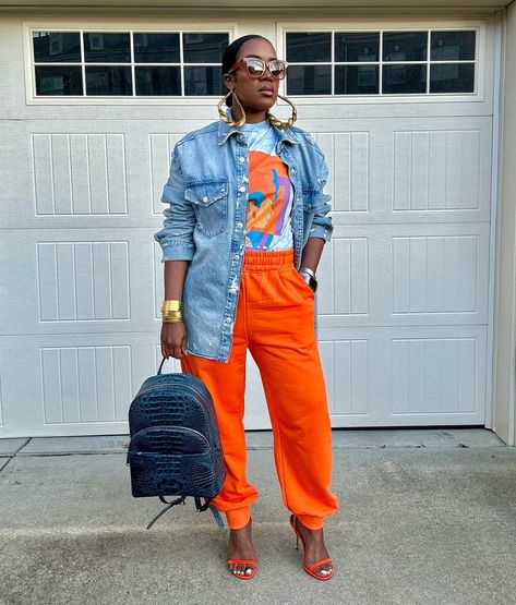 ~Recap of the OOTD~ Swipe to see the look styled with sneakers as well. Watch previous reel for step by step details! 🤎🧡 . . 📌Shop exact and similar options on my @shop.ltk page linked in my bio. . . ✨What I’m wearing: *Denim shirt: @zara *Graphic tee: @merchbar (gifted) *Sweatpants: @amazonfashion *Sneakers: @jumpman23 via @stockx *Heels: @express *Backpack: @brahmin (gifted) *Earrings: @itsallculture_statementjewelry *All bracelets and Apple Watch band: @amazonfashion *Sunglasses: @quay... Womens Graphic Tees Outfits, Denim Outfit With Sneakers, How To Style A Tee Shirt, Graphic Tee Work Outfit, Summer Errands Outfit Casual, Orange Heels Outfit, Bracelets And Apple Watch, Outfits With Orange, Orange Wardrobe